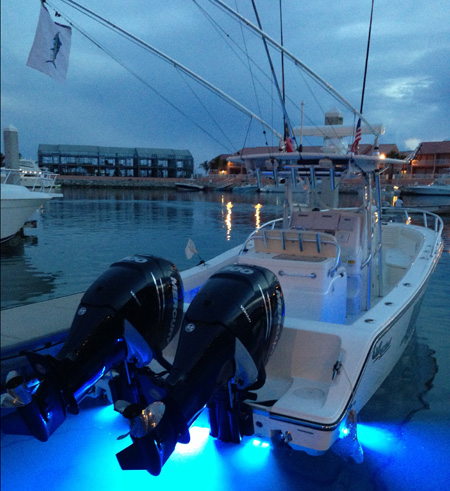 The author&rsquo;s boat at rest at Bimini Sands, proudly displaying a marlin release flag, the second one in two days of fishing.  Note the open array radar antennae.