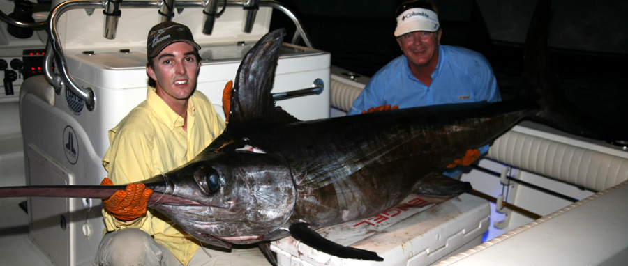 Victorious! Nick Stanczyk and Poveromo, with the the 256-pound swordfish that had Poveromo in the water during the early rounds. Victorious! Nick Stanczyk and Poveromo, with the 256-pound swordfish that had Poveromo in the water during the early rounds.
