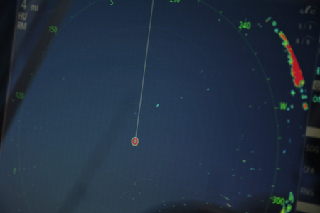 Note the birds on the author&rsquo;s Simrad radar, at 1:00 o&rsquo;clock from the center boat position.