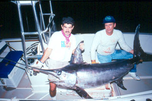 Try to establish and maintain a steady pump-and-wind fighting rhythm all the way to the boat.  Any change in that rhythm during the final stages of the battle may trigger a last-ditch run.